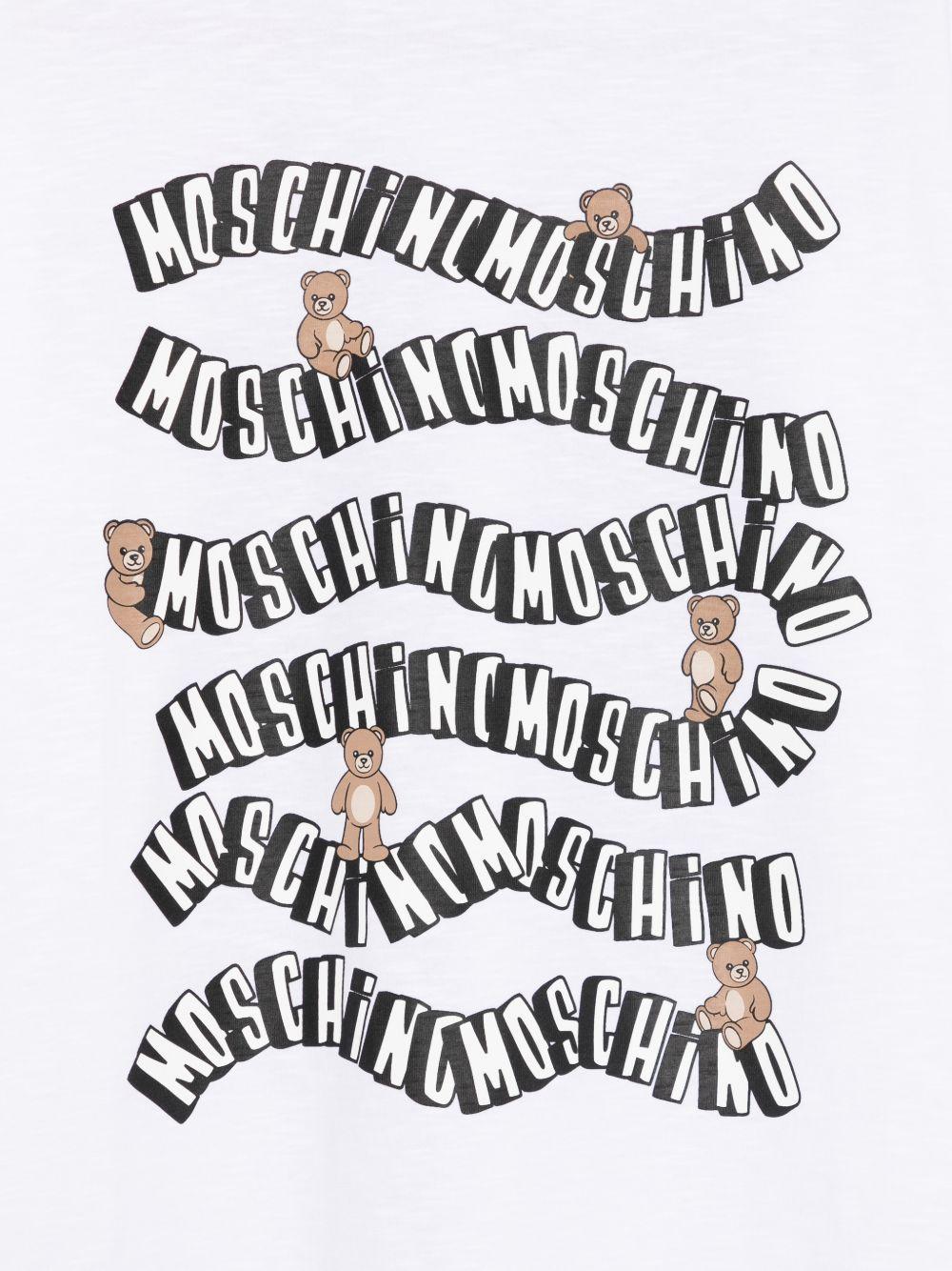 T-shirt per bambini Moschino Kids bianca con stampa grafica sul davanti - Rubino Kids