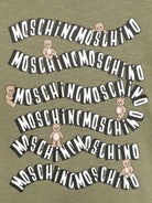 T-shirt per bambini Moschino Kids verde con stampa logo ondulata - Rubino Kids