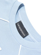 T-shirt per bambino Emporio Armani Kids azzurra con toppa con logo sul davanti - Rubino Kids
