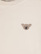 T-shirt per neonata Donsje Jarne beige con ricamo sul petto - Rubino Kids