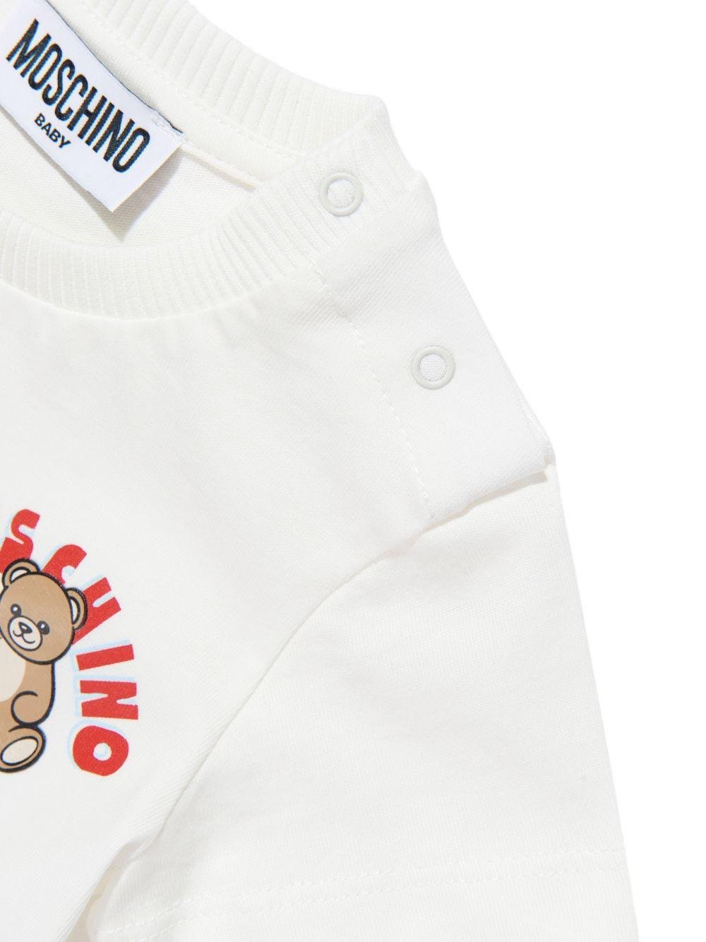 T-shirt per neonati Moschino Kids bianca con logo sul davanti - Rubino Kids