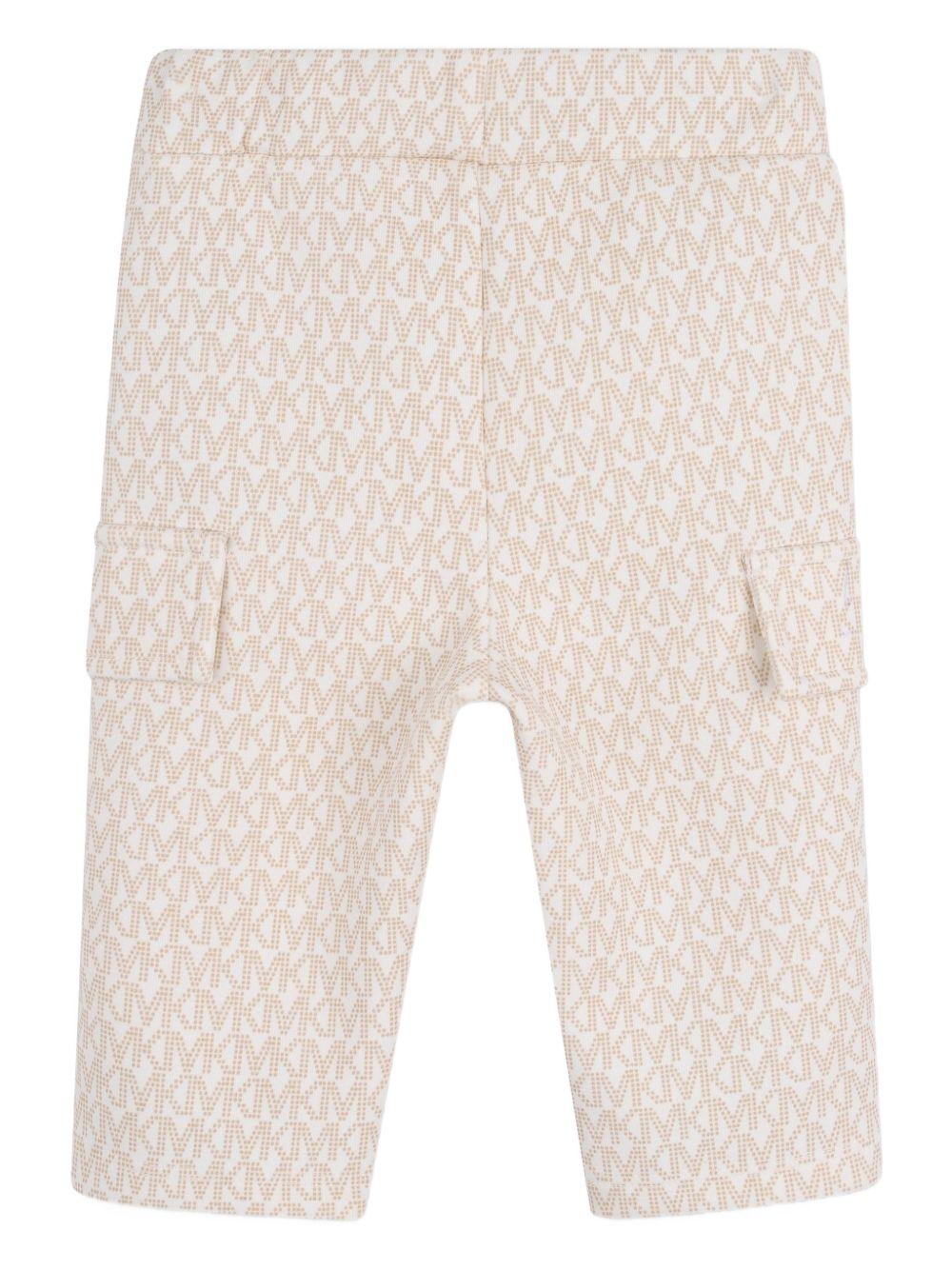 Tuta sportiva per neonata Michael Kors Kids bianco con stampa logo all - over - Rubino Kids